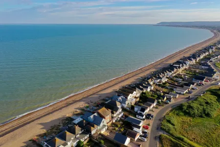 An aerial view of houses along a coastline